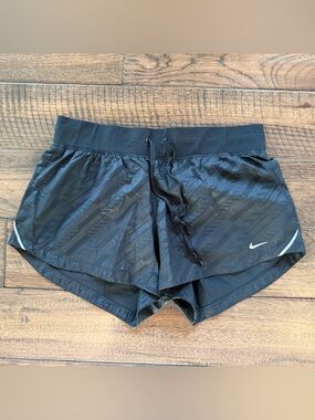 Nike Women’s Black Athletic Shorts with Subtle Black Pattern, Medium